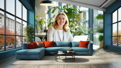 Russian female executive in a bright, open-plan office with plants and natural light Wall mural