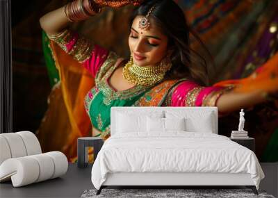 Vibrant Gujarati young woman in colorful lehnga choli playing dandiya Wall mural