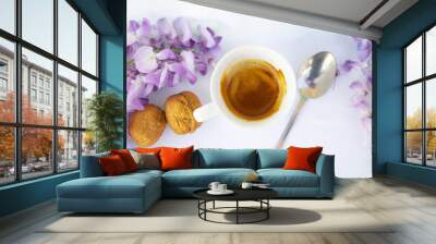 white cup of coffee with strawberries and purple flowers on a table ready for breakfast Wall mural