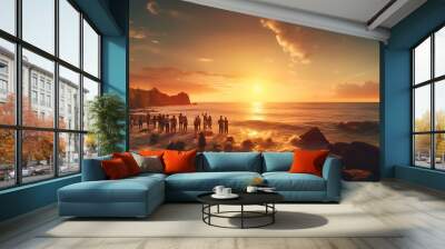 Silhouette of a group of people on the beach at sunset Wall mural