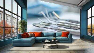 Closeup of silver dental tools on table Wall mural