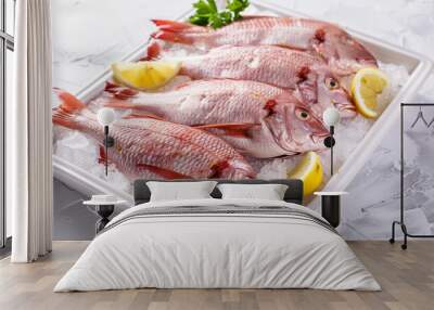 Fresh fish on ice with lemons Wall mural