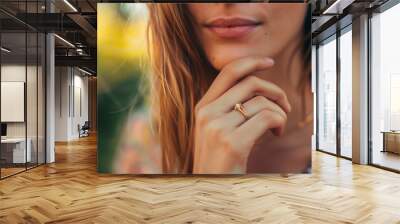 Golden ring on female hand Wall mural