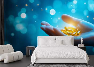 Hand holds glowing modern medicine pills on blue blurred background - concept of modern innovative treatment banner Wall mural