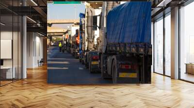 Close up of a cargo truck stuck in traffic, a line of cars on the highway Wall mural