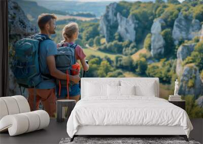 two young backpackers a female and male friends hiking in the mountains
 Wall mural