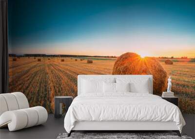 Rural Landscape Field Meadow With Hay Bales During Harvest In Sunny Evening. Late Summer Wall mural