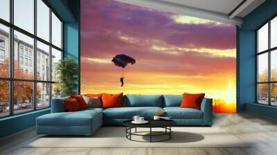 Skydiver On Colorful Parachute In Sunny Sky Wall mural