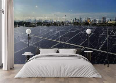 Smart green city concept.solar panels linkage to  the city need power. Green energy for the city. Wall mural