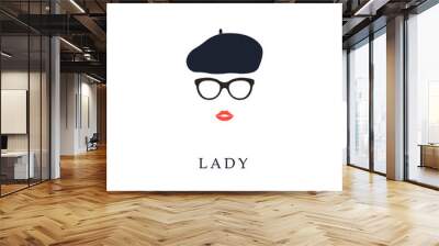 Beautiful trendy French woman wearing glasses and beret. Fashion girl portrait. Wall mural