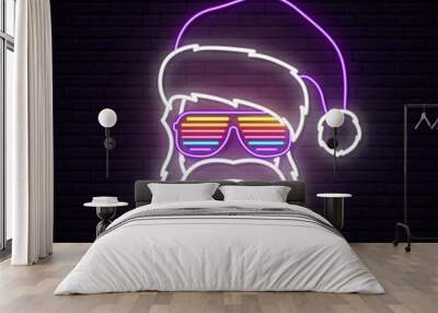 Santa Claus neon sign. Hipster wearing in shutter glasses and Santa Claus hat. Bright Christmas vector illustration. Wall mural