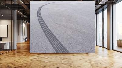 Curved tyre track on asphalt with copy space Wall mural