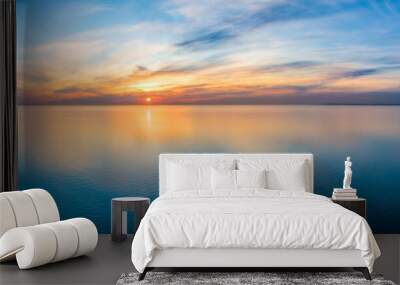 Wide aerial panorama of seascape - sunset reflecting in calm sea Wall mural