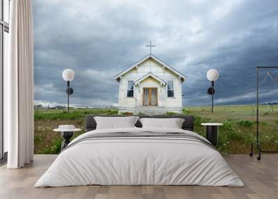 Old church under a cloudy sky. Wall mural