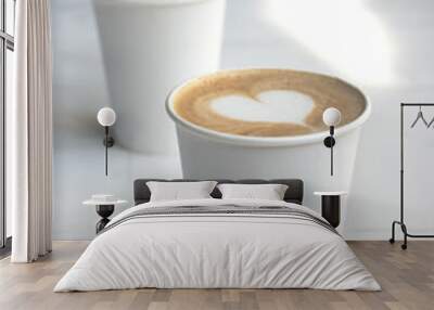 Two white paper cups of coffee on wooden table. Wall mural