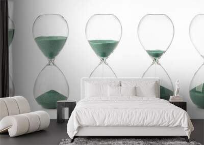 Collection of hourglasses with green sand Wall mural