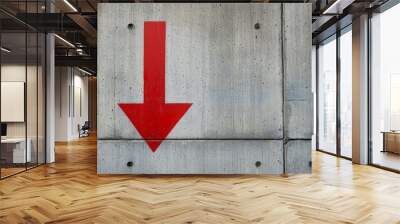 A bold red arrow on a grey concrete wall Wall mural