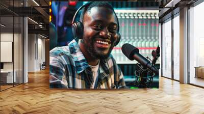 A handsome male DJ doing podcast in a studio Wall mural