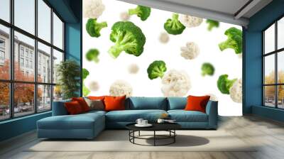 Falling cauliflower and broccoli, isolated on white background, selective focus Wall mural