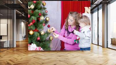 Mum and daughter decorate Christmas tree Wall mural