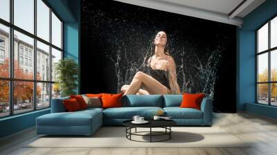 portrait of woman sitting in the water Wall mural