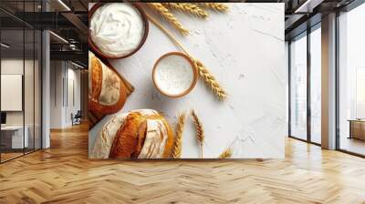 Fresh sourdough bread and ingredients on white background. Wall mural