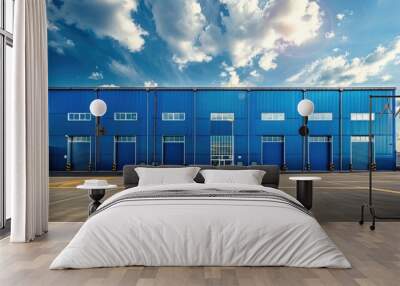 Big modern building for storage or logistics centre. Blue sky in the background. Wall mural