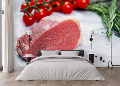 a pieces of fresh meat, beef slab, decorated with greens and vegetables Wall mural