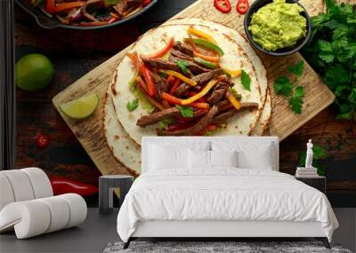 Beef Steak Fajitas with tortilla mix pepper, onion and avocado on wooden board Wall mural