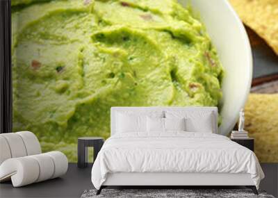 Bowl of fresh Guacamole with nachos chips and herbs. Healthy Vegan, Vegetables food. Wall mural