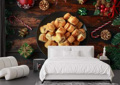 Christmas Sausage Rolls with decoration, gifts, green tree branch on wooden rustic table Wall mural