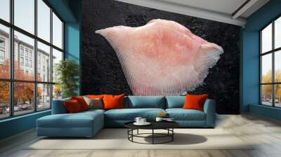 Fresh Ray wings fish on rustic black background Wall mural