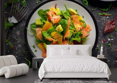 Fresh salmon salad with avocado, orange and green vegetables. Wall mural