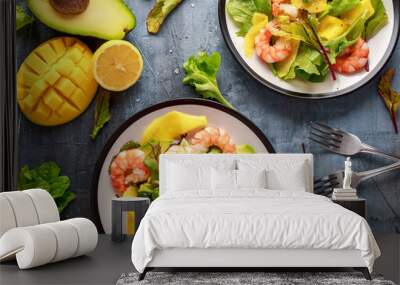 Fresh Shrimps, Avocado, Mango salad with lettuce green mix, herbs, lemon, healthy food. Wall mural