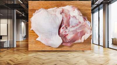 Fresh skinless chicken thighs on cutting board Wall mural