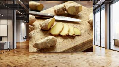 Fresh slice of Ginger on wooden chopping board. healthy food Wall mural