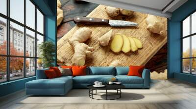 Fresh slice of Ginger on wooden chopping board. healthy food Wall mural