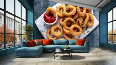 Fried Onion Rings with Ketchup on white cutting board. Wall mural