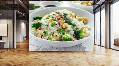 Fried rice with vegetables, broccoli, peas and eggs in a white bowl. healthy food Wall mural