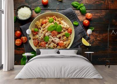 Healthy Chicken, fusilli pasta with tomatoes, basil and parmesan cheese. on wooden table. Wall mural