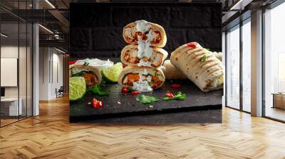 Healthy grilled chicken and parsley wraps, loaded with cheese, served with greek yogurt deep, chillies and lime slices Wall mural