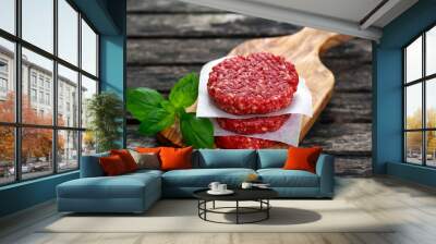 Home HandMade Minced Beef burgers on cutting board. old wooden table Wall mural