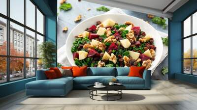 Kale salad with apple, beetroot, walnut and raisins in white plate. Healthy food Wall mural