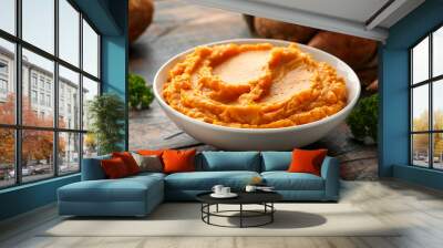 Mashed Sweet Potatoes in white bowl on wooden rustic table. Healthy food Wall mural