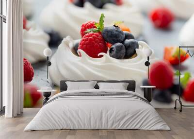 Meringue nest mini pavlova cake with fresh berries strawberry blueberry raspberry and mint for healthy desert. Wall mural