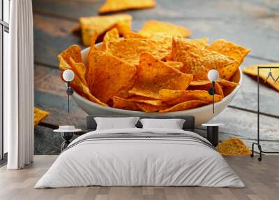 Mexican corn, tortilla cheese chips in a white cup on wooden table Wall mural