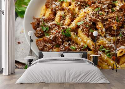 Pasta alla Genovese on a white bowl with parmesan cheese. Traditional neapolitan food. Wall mural