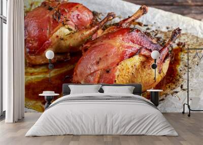 Ready to eat Roast partridges with bacon on crumpled paper. Wall mural