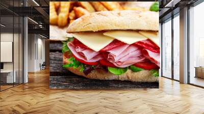 Sandwich with lettuce, slices fresh tomatoes, salami, hum and cheese Wall mural