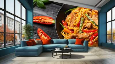 Stir fry chow mein noodles with pork and vegetable in black bowl. asian style food Wall mural